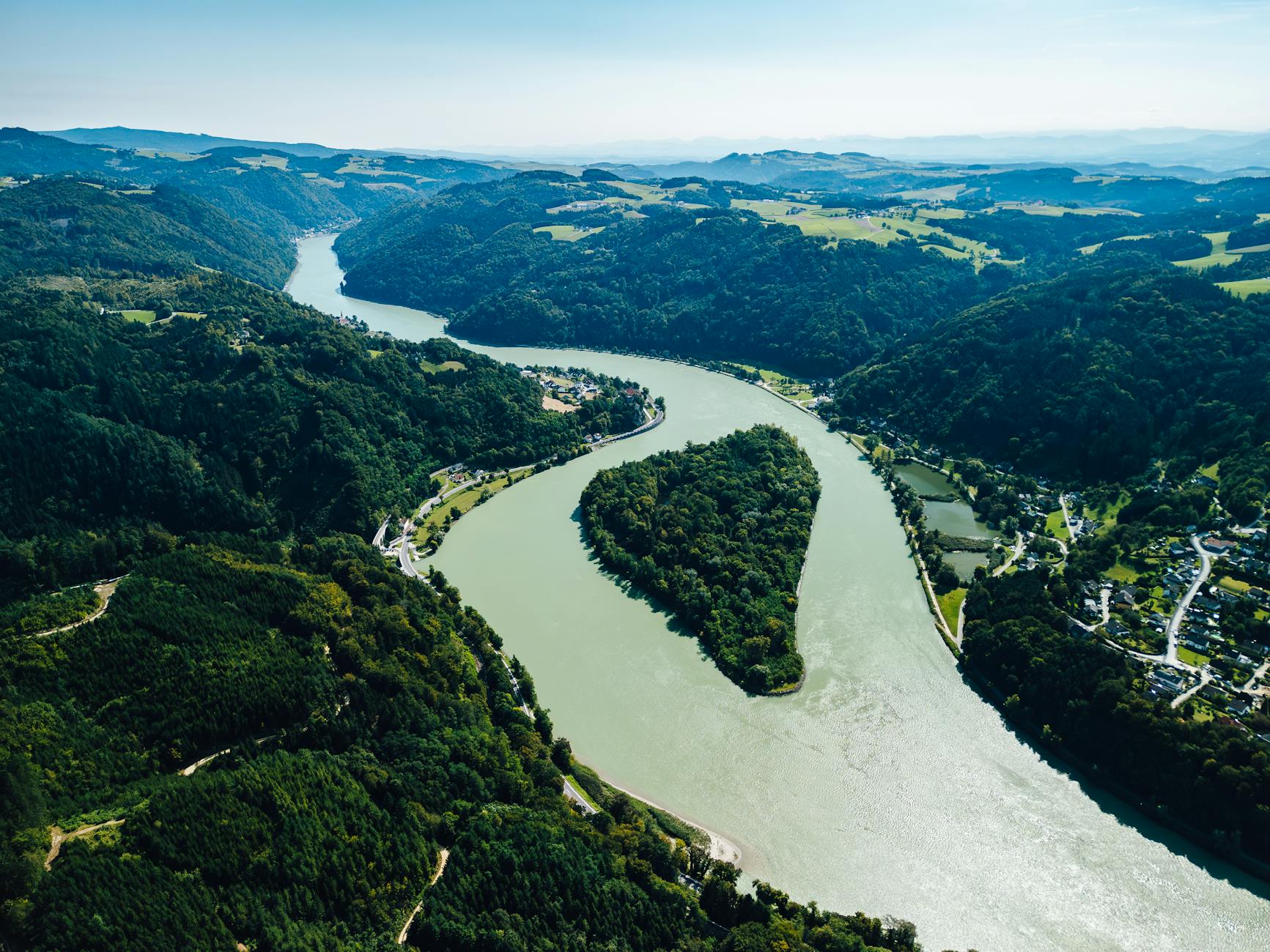 Scenic aerial view of the Danube River winding through lush Austrian landscape