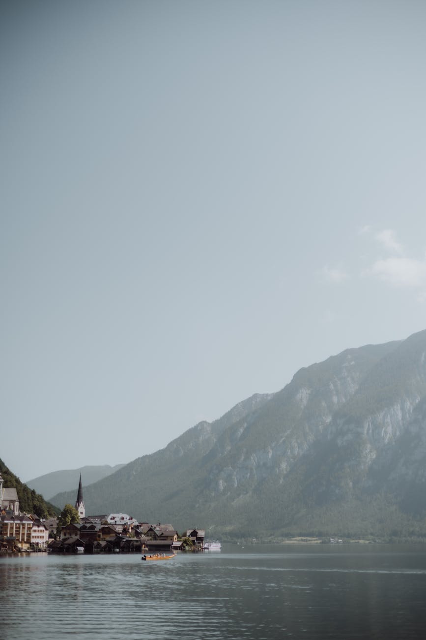 Breathtaking view of Hallstatt village with alpine mountains reflected in lake