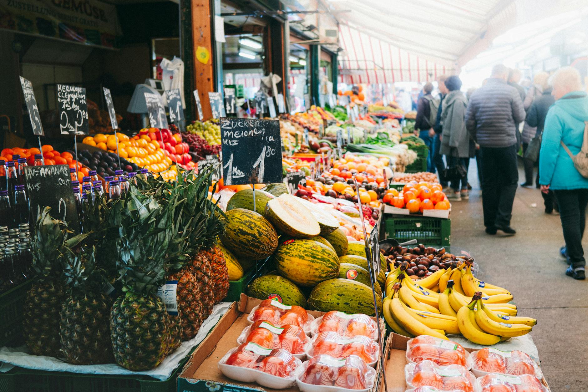Colorful fruits and vegetables on display at Vienna's Naschmarkt outdoor food market