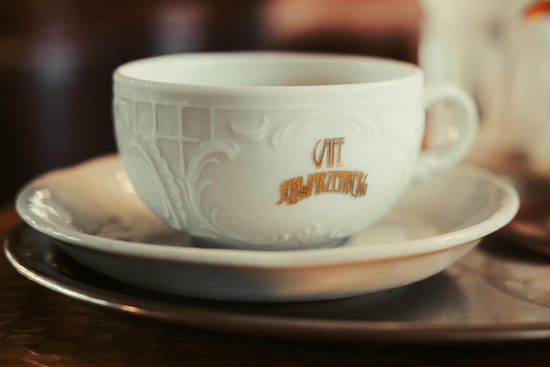 A traditional Viennese coffeehouse interior with marble tables