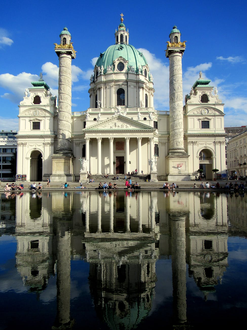 Karlskirche Vienna baroque church with dome and columns reflected in pool