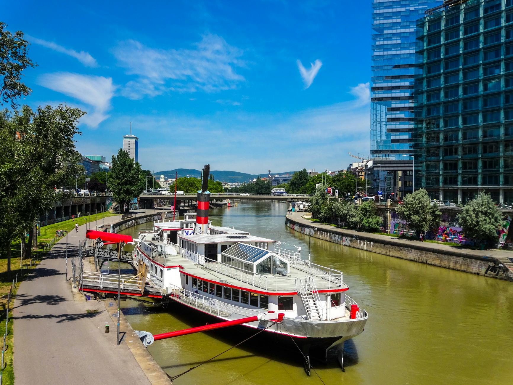 Modern boat docked on the Danube Canal in Vienna