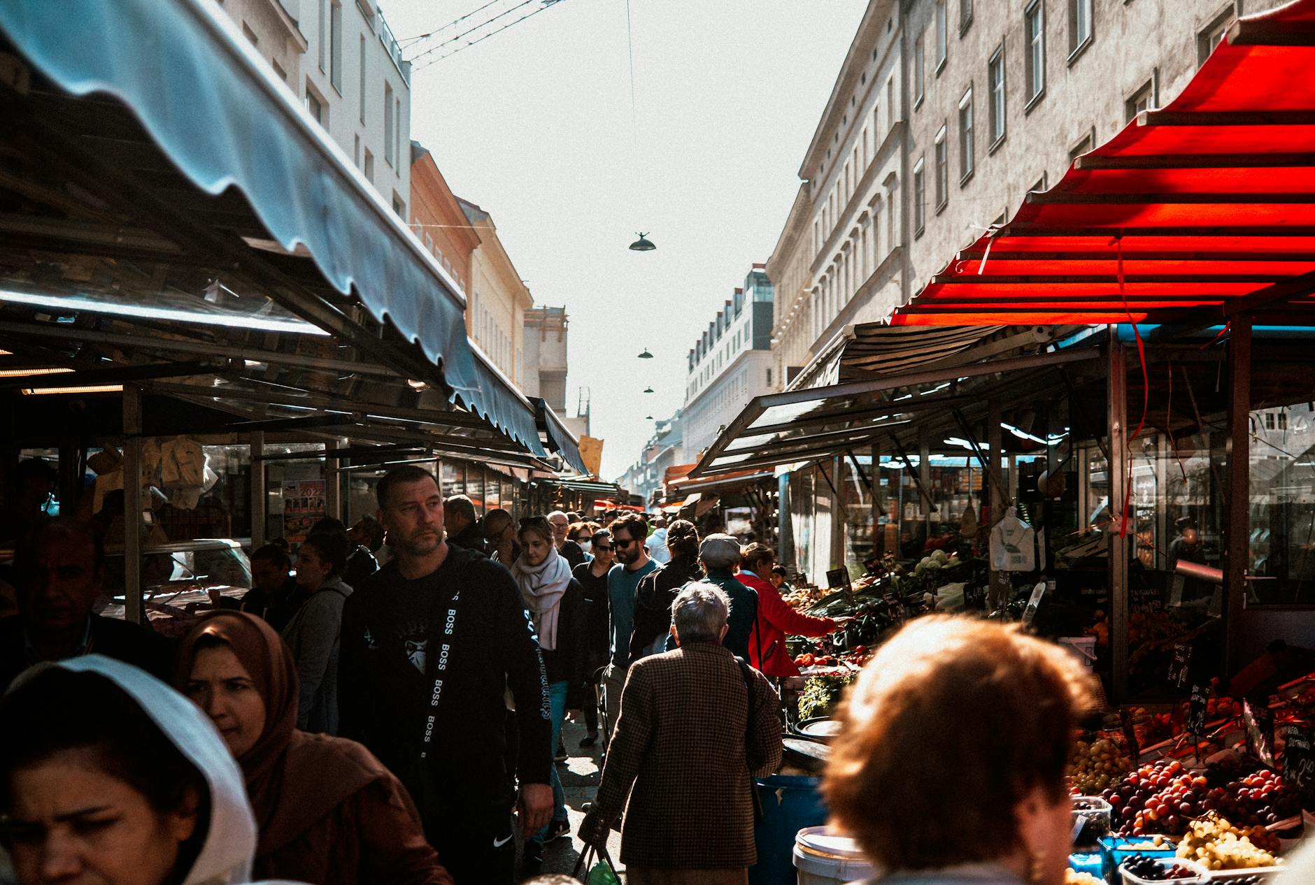 Vibrant stalls and diverse crowds at the Naschmarkt — Vienna's legendary food market
