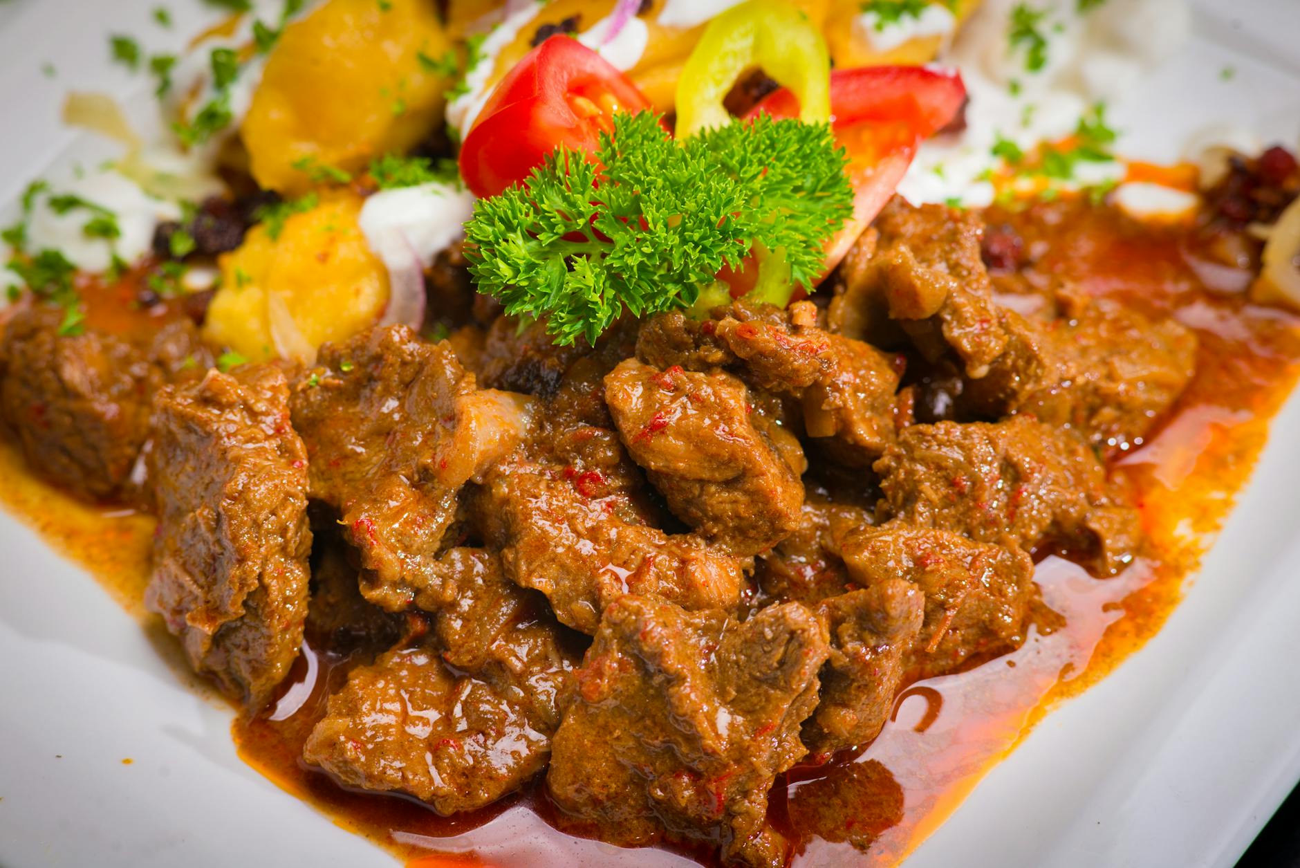 Wiener Saftgulasch — Vienna's rich beef goulash, denser and saucier than Hungarian versions