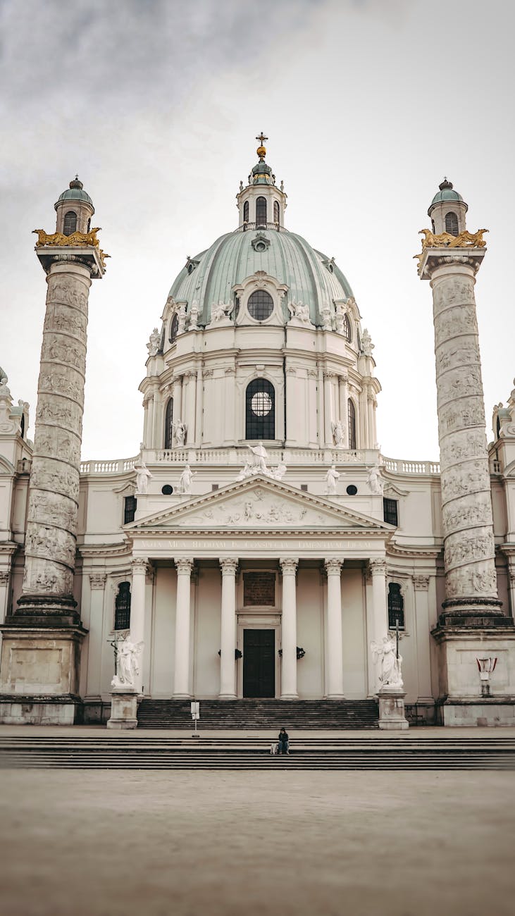 Stunning baroque church interior with ornate gilded decorations frescoes and marble columns