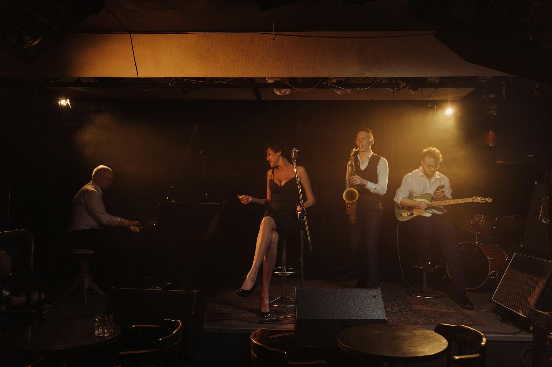 Jazz band performing live on stage with singer and musicians