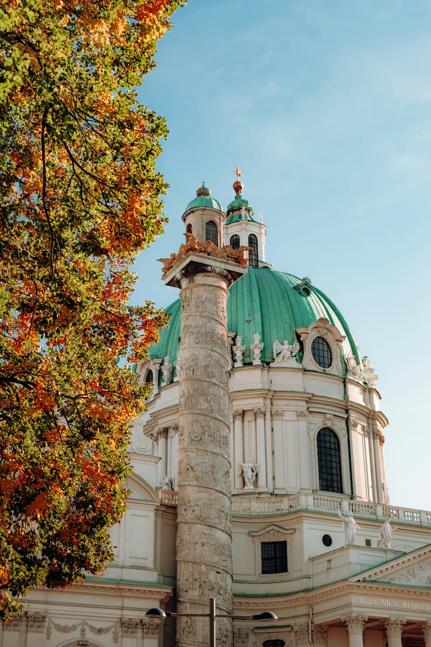 Autumn view of Karlskirche with vibrant foliage in Vienna