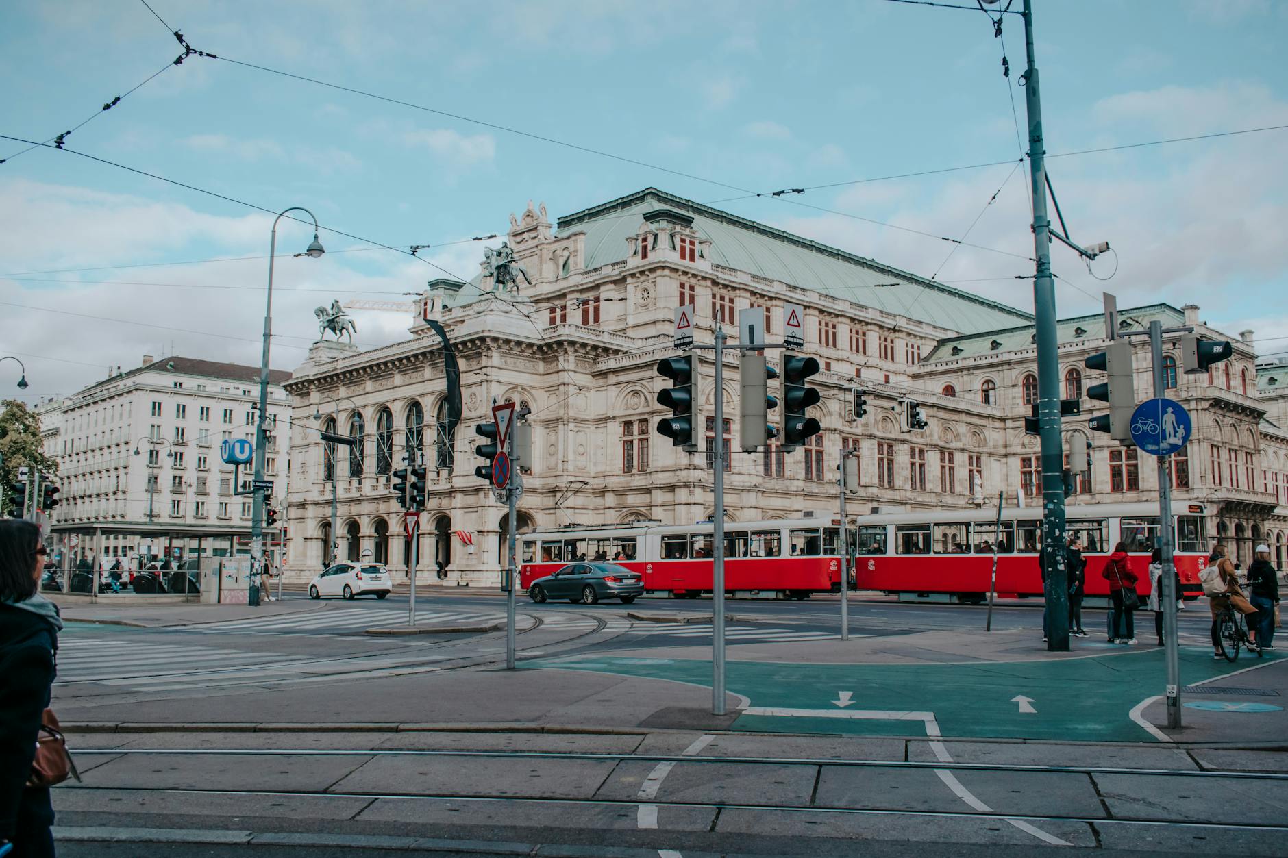 Red tram passing the Vienna State Opera on the Ringstraße
