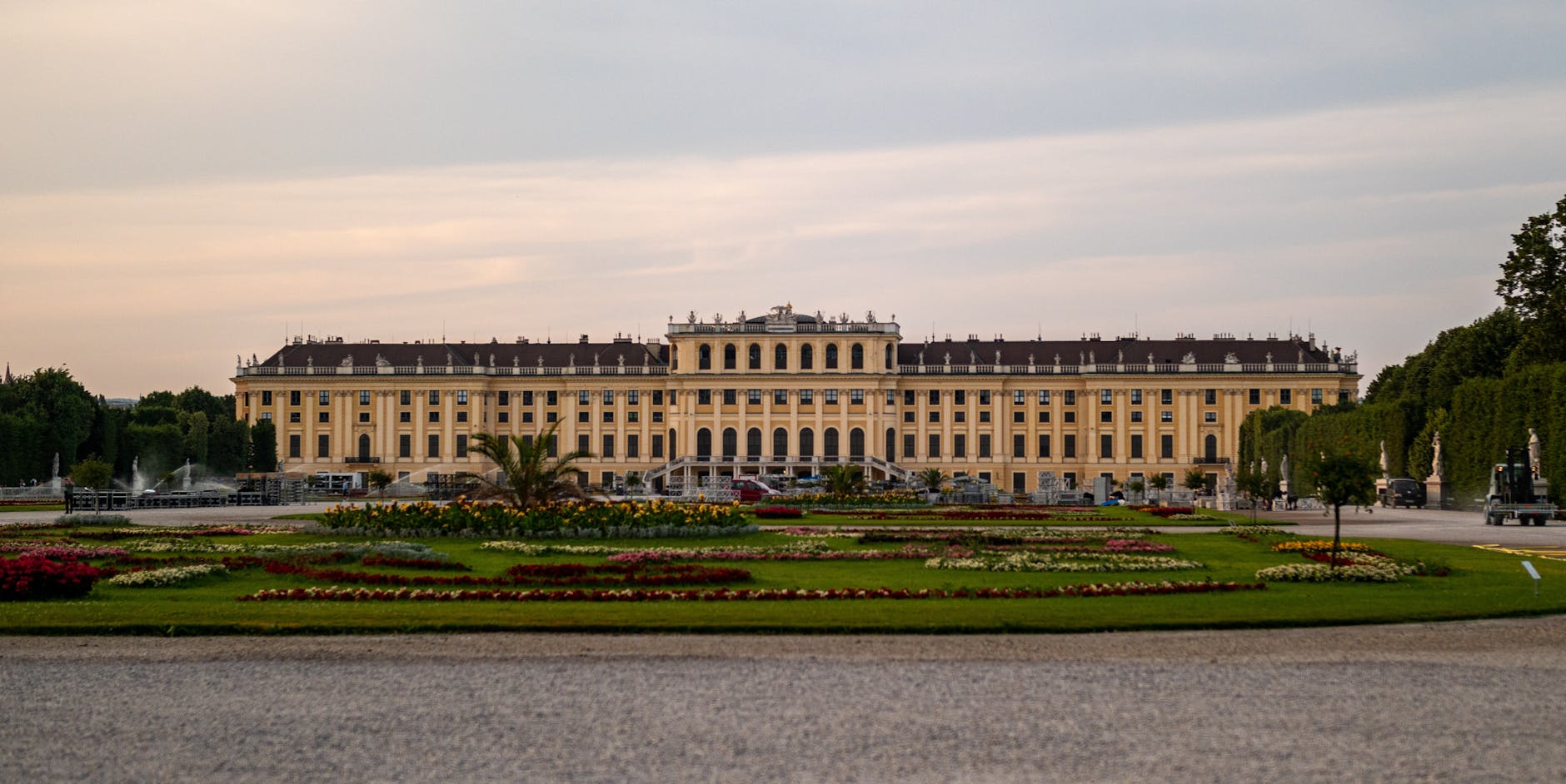 The 120-hectare Baroque gardens — tulips in spring, formal hedges, and the Neptune Fountain