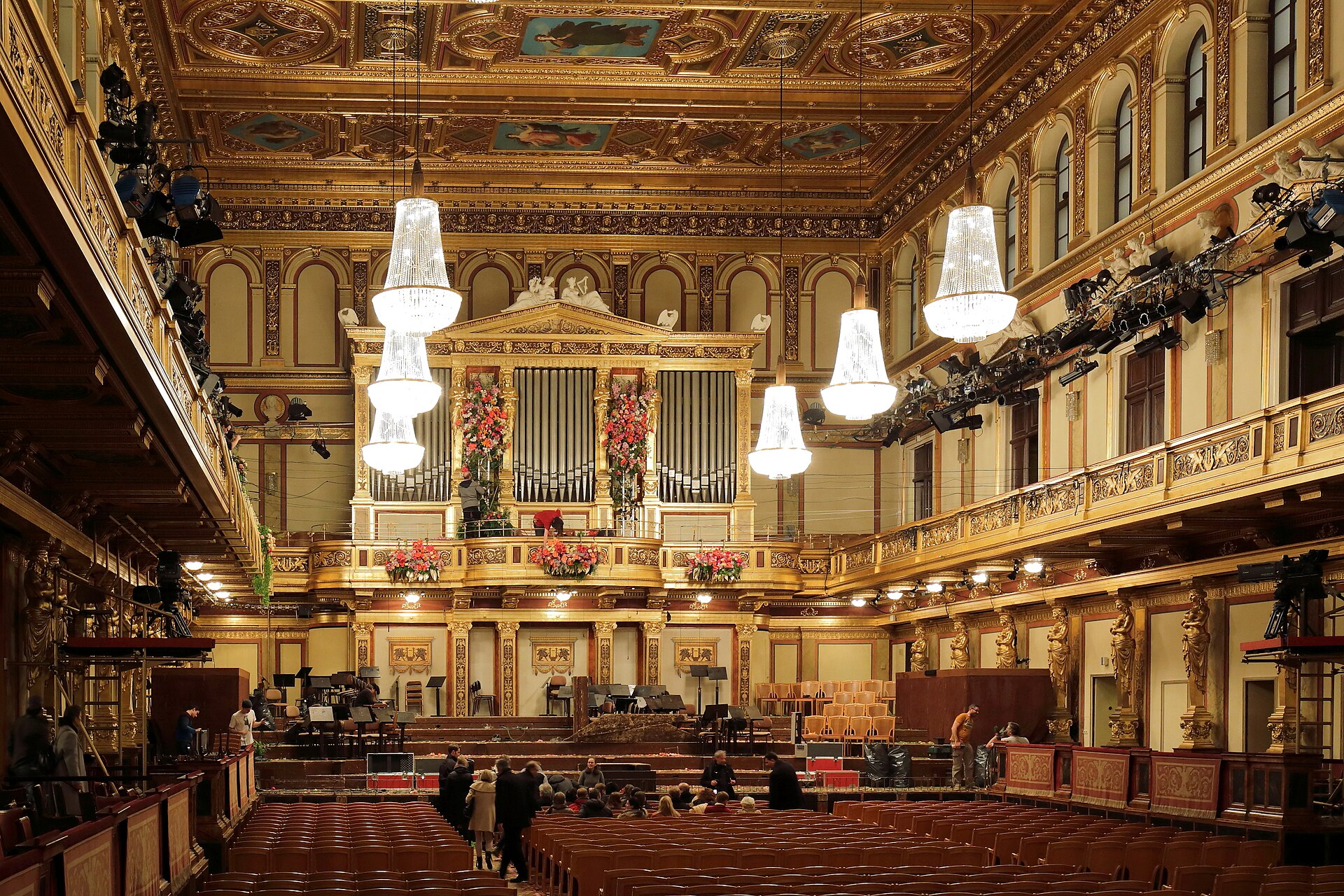 The Golden Hall of the Vienna Musikverein seen from the rear stalls, with gilded caryatids, painted ceiling panels, chandeliers and the organ above the stage